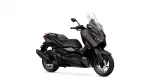 Dark brown Yamaha scooter from a right-side angle, showing a tall clear windshield and sleek bodywork. This is a sport-touring style motorcycle with a two-person seat and prominent front fairing.
