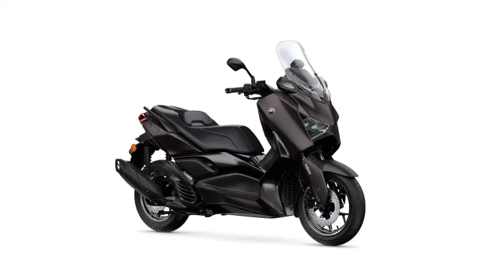 Dark brown Yamaha scooter from a right-side angle, showing a tall clear windshield and sleek bodywork. This is a sport-touring style motorcycle with a two-person seat and prominent front fairing.
