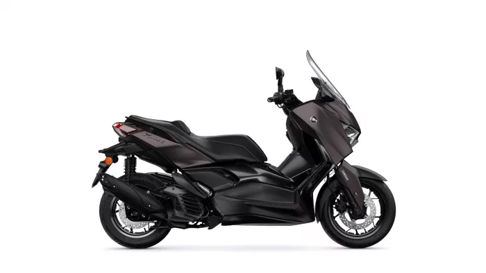 Side view of a black Yamaha X-MAX sport scooter with a tall windshield.