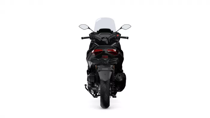 Rear view of a black sport motorcycle with a clear windshield and red taillights