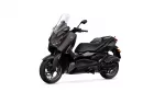 Black Yamaha motorcycle shown from a side-front angle with a tall clear windshield