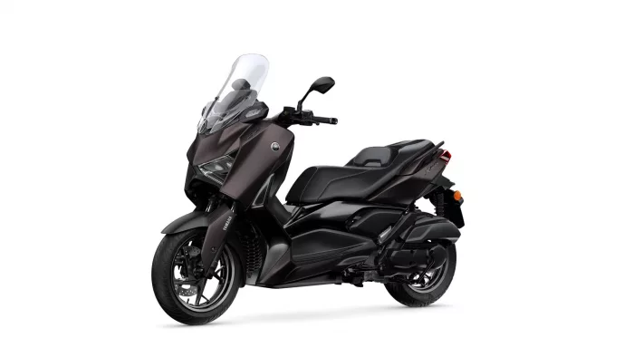Black Yamaha motorcycle shown from a side-front angle with a tall clear windshield