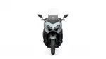 Front view of a modern sport motorcycle with a clear windshield and dual headlights.