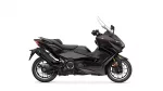 Left-side profile view of a black Yamaha Tmax sport scooter with windshield against a white background
