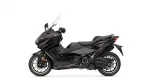 Black Yamaha Tmax sport scooter shown in profile against a white background.