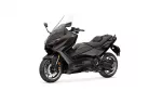 Dark burgundy Yamaha sport-tourer motorcycle shown from a front-left angle with a tall windshield and visible dual discs on the front wheel.