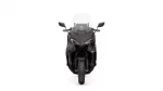 Front view of a dark sport motorcycle with a tall windshield and angular fairing against a white background.