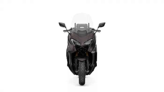 Front view of a dark sport motorcycle with a tall windshield and angular fairing against a white background.