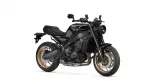 Yamaha XSR900 motorcycle shown from a front-side angle with black body and gold wheels.