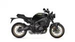 Yamaha XSR900 motorcycle shown in black with gold rims, side profile view.