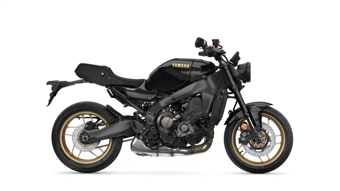 Yamaha XSR900 motorcycle shown in black with gold rims, side profile view.