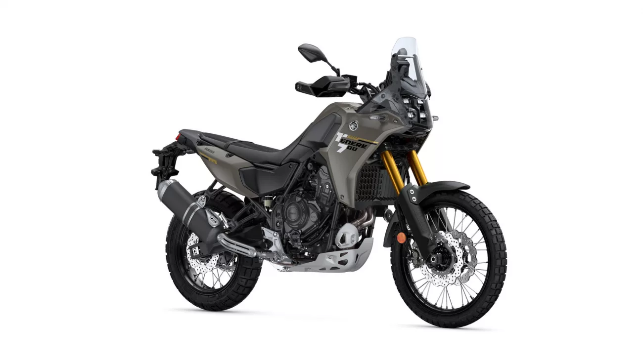 Yamaha Tenere 700 adventure motorcycle in gray, shown from a front-right side angle with gold front forks.