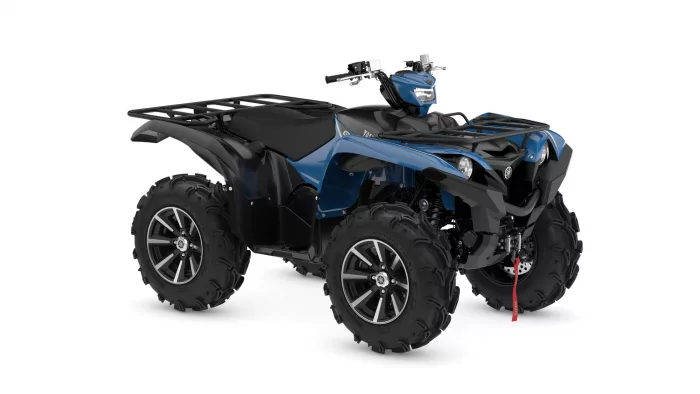 2025-yamaha-yfm700fwad-25s-eu-dusty_blue-360-degrees-001-03 | q2moto Blue all-terrain quad bike with large rugged tires and front storage rack on the rear rack area.