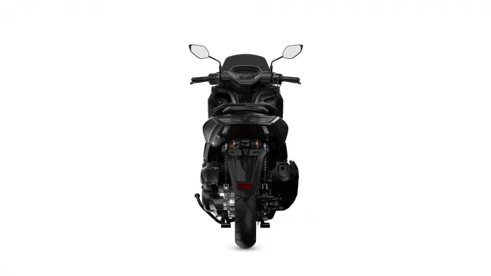 Rear view of a black sport motorcycle against a white background, showing taillights and rear wheel.