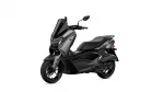 Front-and-side view of a gray and black Yamaha sport scooter with a tall windshield and handlebars visible.