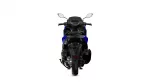 Rear view of a blue sport motorcycle showing the taillight, seat, and wide rear tire from behind.
