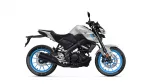 Side view of a silver and black Yamaha motorcycle with bright blue rims and exposed engine components.