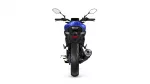 Rear view of a blue sport motorcycle on a white background, showing taillight, rear tire, and exhaust area.