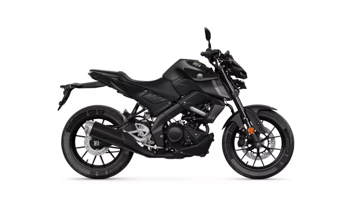 Side view of a matte black Yamaha sport motorcycle, showing its sleek angular body and exposed engine.