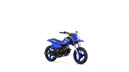 Blue Yamaha dirt bike shown in a three-quarter front-left view with knobby tires and black engine parts on a white background.