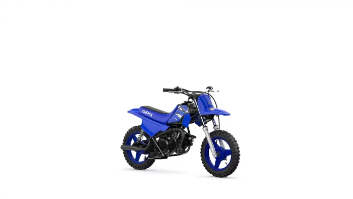 Blue Yamaha dirt bike shown in a three-quarter front-left view with knobby tires and black engine parts on a white background.