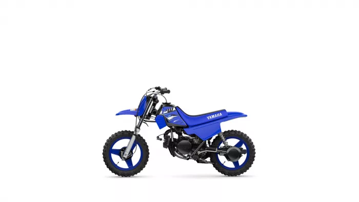 Blue Yamaha dirt bike shown from the side with knobby off-road tires, isolated on white background