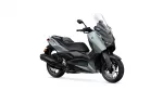 Silver-gray Yamaha XMAX scooter with a tall clear windshield and black accents, shown in a side view.