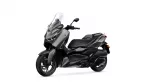 Black and gray Yamaha XMAX scooter with a tall clear windshield on a white background