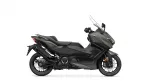 Side view of a dark gray Yamaha motorcycle with a windshield and black accents, shown on a white background.