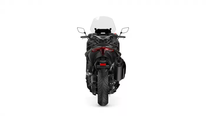 Rear view of a black sport motorcycle with a clear windscreen and red taillights at the back.