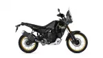 Side view of a black Yamaha Tenere 700 World Raid adventure motorcycle with gold wheels and tall windscreen