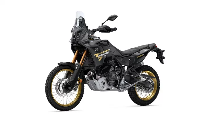 Yamaha Tenere 700 World Raid adventure motorcycle in matte black with gold wheels, shown in profile on a white background.