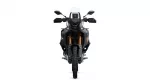 Front view of a black adventure motorcycle facing the camera, with a white windscreen and gold front forks against a white background.
