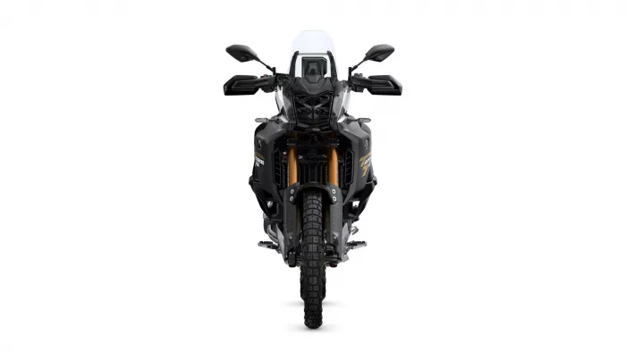 Front view of a black adventure motorcycle facing the camera, with a white windscreen and gold front forks against a white background.