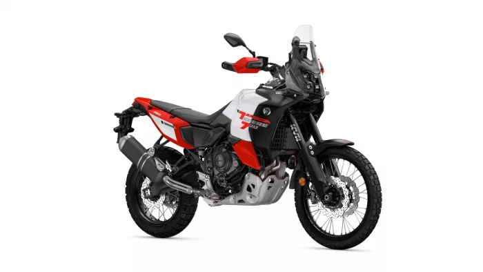 Yamaha Tenere 700 World Raid adventure motorcycle, red/white/black, shown from a front-side angle with tall windshield and off-road tires