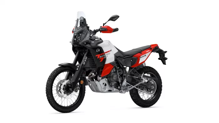 Yamaha Tenere 700 World Raid adventure motorcycle shown in white, red, and black with off-road tires and tall windscreen (side view).