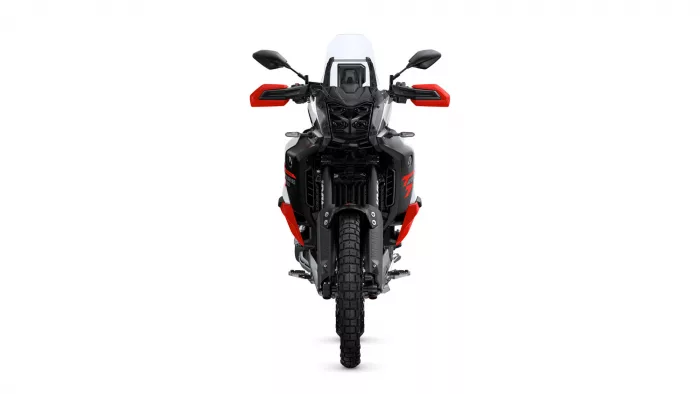Front view of a black-and-red adventure motorcycle with a tall windshield and red handguards, shown head-on against a white background.