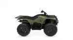 Olive green Yamaha ATV with front and rear cargo racks, large off-road tires, and black seat. Alternative 1