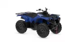 Blue Yamaha ATV (quad bike) with black cargo racks, large knobby tires, and a black seat, shown from a front-left angle for off-road use.