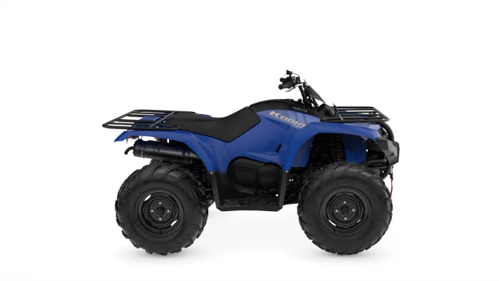 Blue Yamaha ATV with large off-road tires and front/rear racks, side branding reads Kodiak 700/400 model.