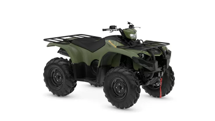 2026-yamaha-yfm450fwbd-eu-olive_green-360-degrees-001-03 | q2moto Olive-green all-terrain vehicle (ATV) with front and rear cargo racks and large knobby tires.