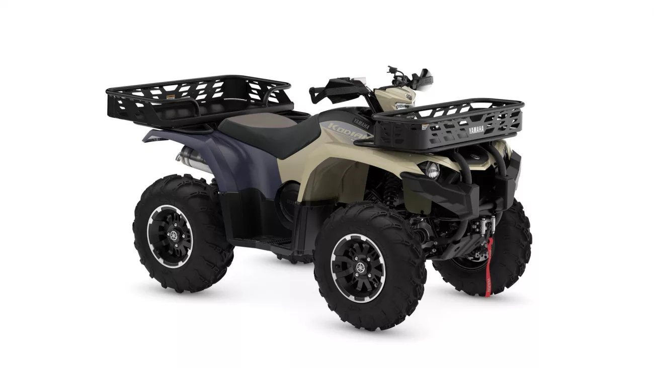 Yamaha ATV with large front and rear cargo baskets for hauling gear on rugged terrain