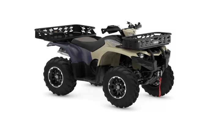 Yamaha ATV with large front and rear cargo baskets for hauling gear on rugged terrain