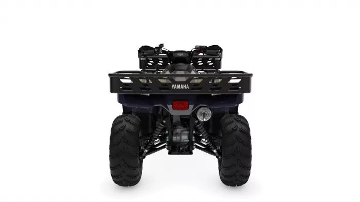 Front view of a Yamaha ATV with a black bumper and rugged knobby tires visible.