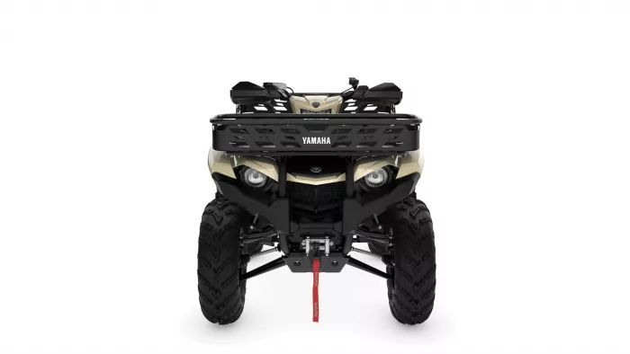 Front view of a beige Yamaha ATV with a black rack and large knobby tires, logo visible on the grille.