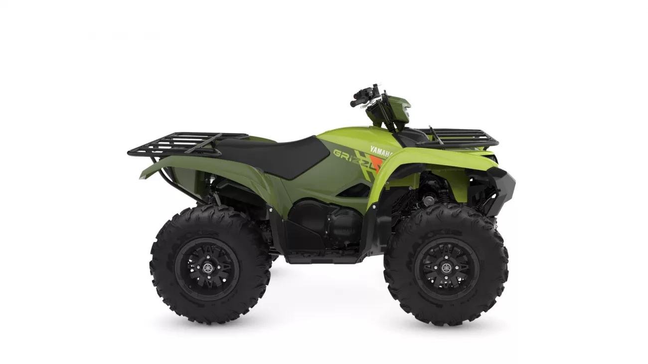 Green Yamaha Grizzly ATV shown in a side profile with front and rear cargo racks on a white background.