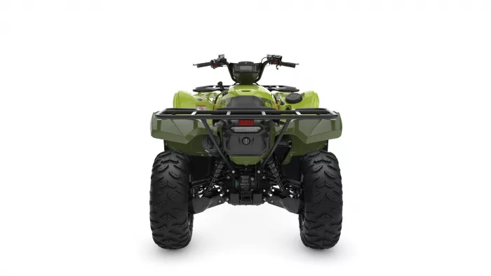 Rear view of a green all-terrain vehicle (ATV) with a rear cargo rack and large knobby tires on a white background, showing suspension.