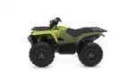 Green Yamaha Grizzly ATV with front and rear cargo racks and chunky off-road tires photographed in profile