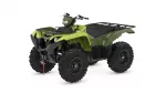 Green ATV with black rack and large knobby tires, viewed from the front-right.