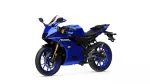 Blue sport motorcycle shown from a three-quarter front-left angle, featuring a blue fairing, gold front forks, and a racing-style windscreen (Yamaha R125 badge visible).